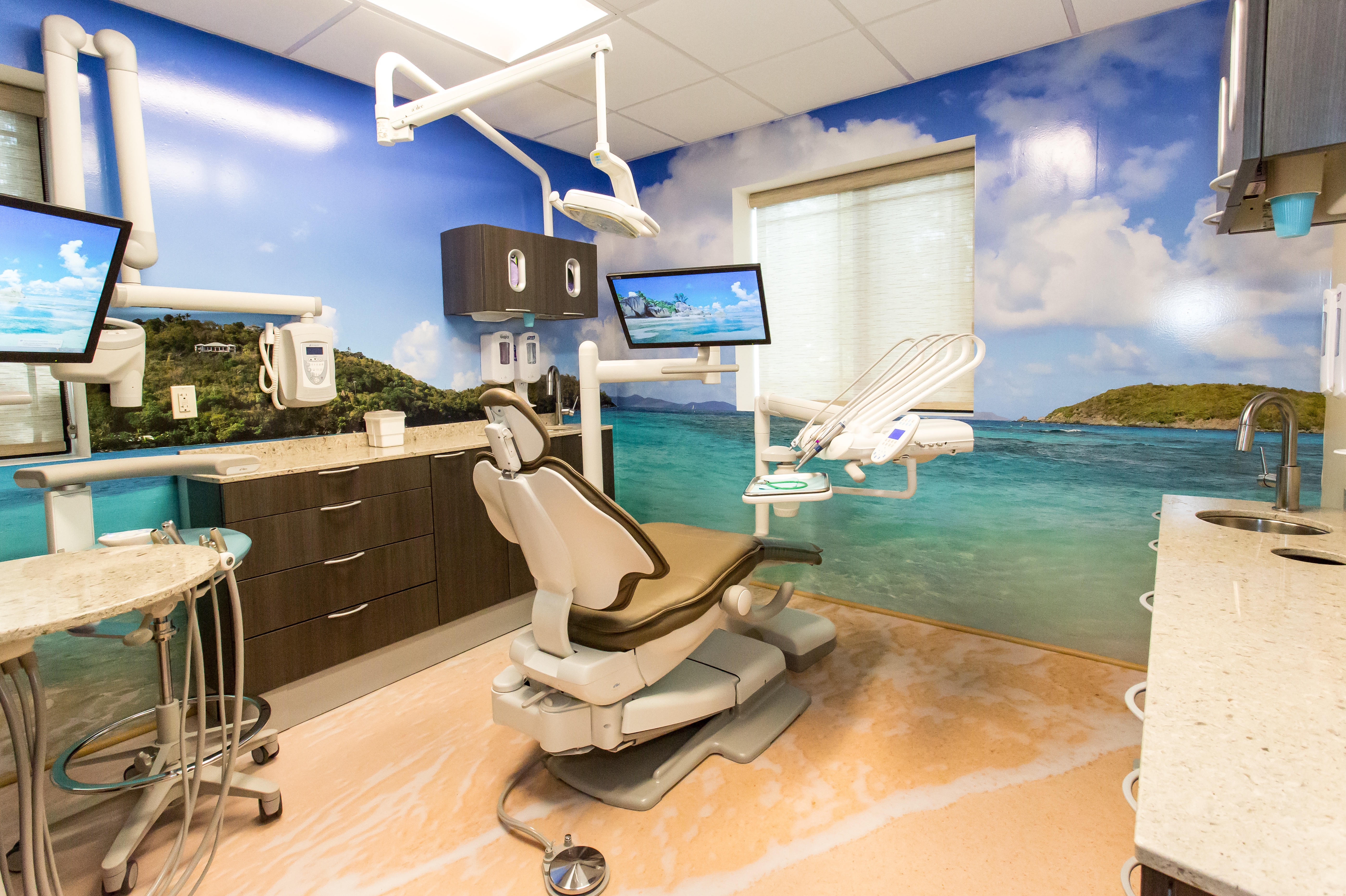 dental office with beach pictures on wall